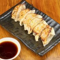 Pork Gyoza · Pan-fried pork and vegetable dumpling. 煎猪肉及蔬菜饺子。.