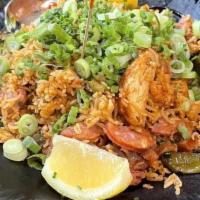 Jambalaya · Cajun spiced rice with shrimp, chicken and house andouille sausage.