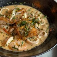 Bouillabaisse · Calamari, shrimps, white fish in lobster stock with cannellini beans  and tarragon
