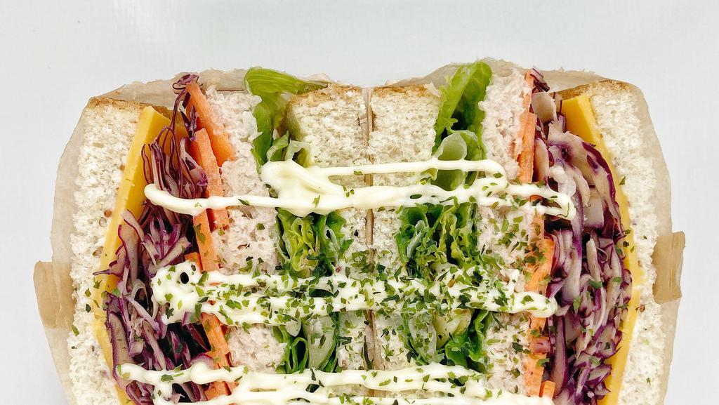 Tuna Salad Sando · Tuna salad, vegetables and cheese sandwich.