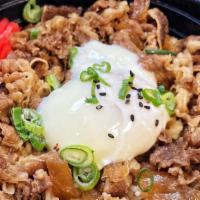Gyudon · Thin sliced beef and onion in shoyu broth over rice topped with one onsen egg (hot spring egg)