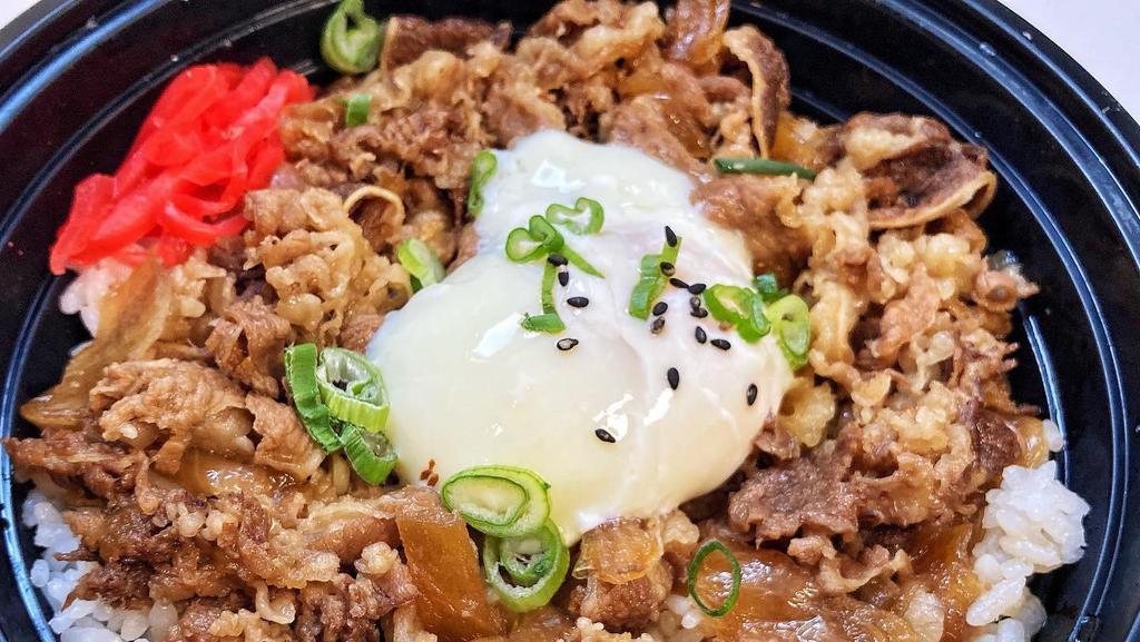 Gyudon · Thin sliced beef and onion in shoyu broth over rice topped with one onsen egg (hot spring egg)