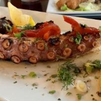 Grilled Octopus · Baby octopus lightly char-grilled and drizzled with olive oil and oregano.