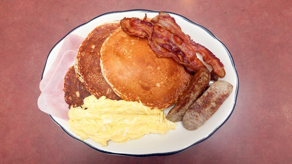 Pancakes Deluxe · With bacon, ham and sausage.
