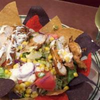 Mexican Fiesta Salad · Leaf lettuce with fresh tomatoes, cheddar, avocado, corn, marinated grilled chicken breast, ...