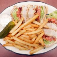 Turkey Club · Served with lettuce, tomato, bacon, pickle, coleslaw and fries.