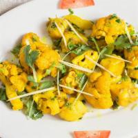 Aloo Gobhi · A popular dish made with cauliflower, potatoes, herbs, and spices.