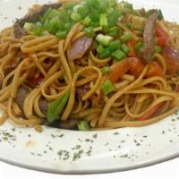 Tallarin Saltado De Carne · Linguini Sautéed with Peruvian Soy Sauce, Strips of Steak, Onions and Tomatoes.