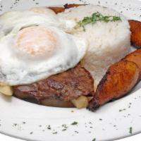 Bistec A La Pobre · Fried steak, served with white rice, sweet plantain, french fries and fried egg.