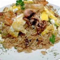 Arroz Chaufa De Mariscos · Calamari and shrimp fried rice with eggs and scallion.