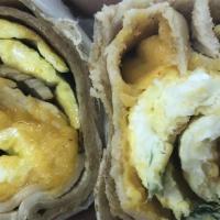 Classic Breakfast Wrap · A warm wrap of your choice, stuffed with scrambled eggs, boar's head ham, melted American ch...
