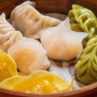 Dumpling Sampler (8) · Two pork dumplings, two shrimp dumplings, two duck dumplings, and two vegetable dumplings.