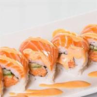 Crazy Salmon Roll · Spicy salmon avocado inside seared salmon on top with spicy mayo eel sauce.