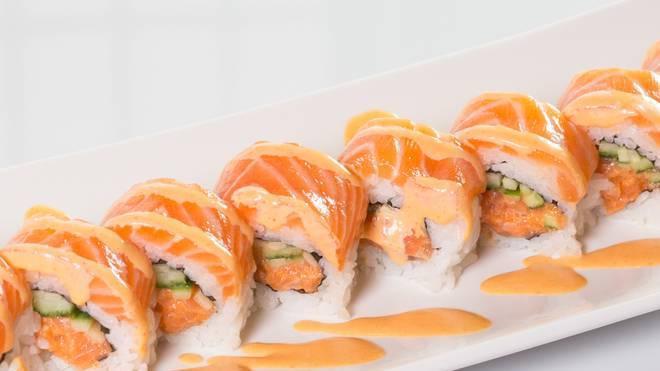 Crazy Salmon Roll · Spicy salmon avocado inside seared salmon on top with spicy mayo eel sauce.