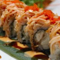 Sakura Roll · Inside shrimp tempura, spicy tuna, and topped spicy crab.