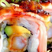 Sakey Roll · Salmon tempura and avocado inside,top with whole crabmeat (eel sauce and spicy mayo).