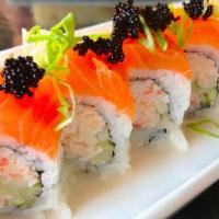 Tri Color Roll · Crab meat, avocado, spicy tempura flakes, and sliced salmon tobiko.