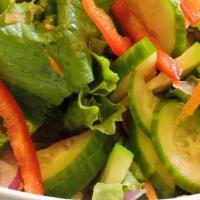 House Salad · Lettuce, carrot, and tomato with ginger dressing.
