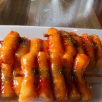 Rice Cake Skewers · 떡꼬치 (Deok Gochi),
Fried rice cake on skewers tossed in house special sweet chili sauce.