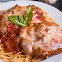 Chicken Parmigiana · Hand-breaded crispy chicken breasts topped with our fresh-made tomato sauce and melted mozza...
