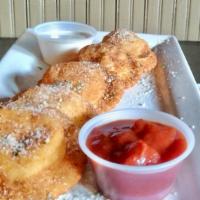 Toasted Cheese Ravioli · Crispy, breaded ravioli filled with cheese.  Served with fresh tomato sauce and ranch dressi...