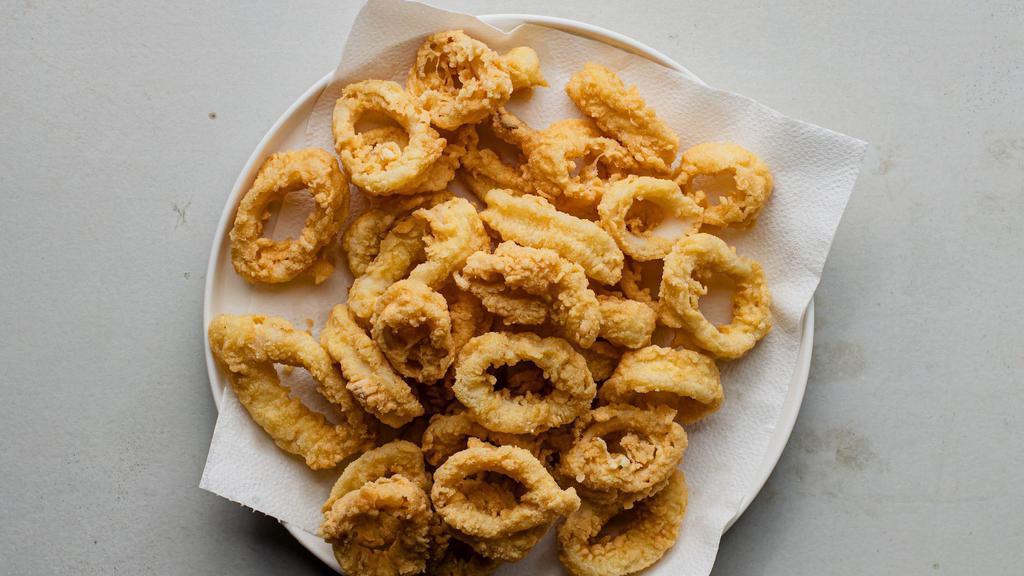 Crispy Calamari · Tender calamari in a crispy, spicy breading.  Served with our fresh-made tomato sauce for dipping.