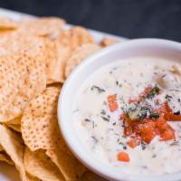 Spinach Artichoke Dip · Our made-from-scratch, creamy dip of artichoke hearts, spinach and Italian cheeses, garnishe...
