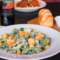 Classic Caesar Salad · Crisp Romaine lettuce, creamy Caesar dressing, seasoned croutons and shredded Romano cheese.