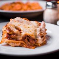 Warehouse Lasagna · Layers of lasagne noodles, our fresh-made meat sauce, Italian pork sausage, ground beef, Rom...