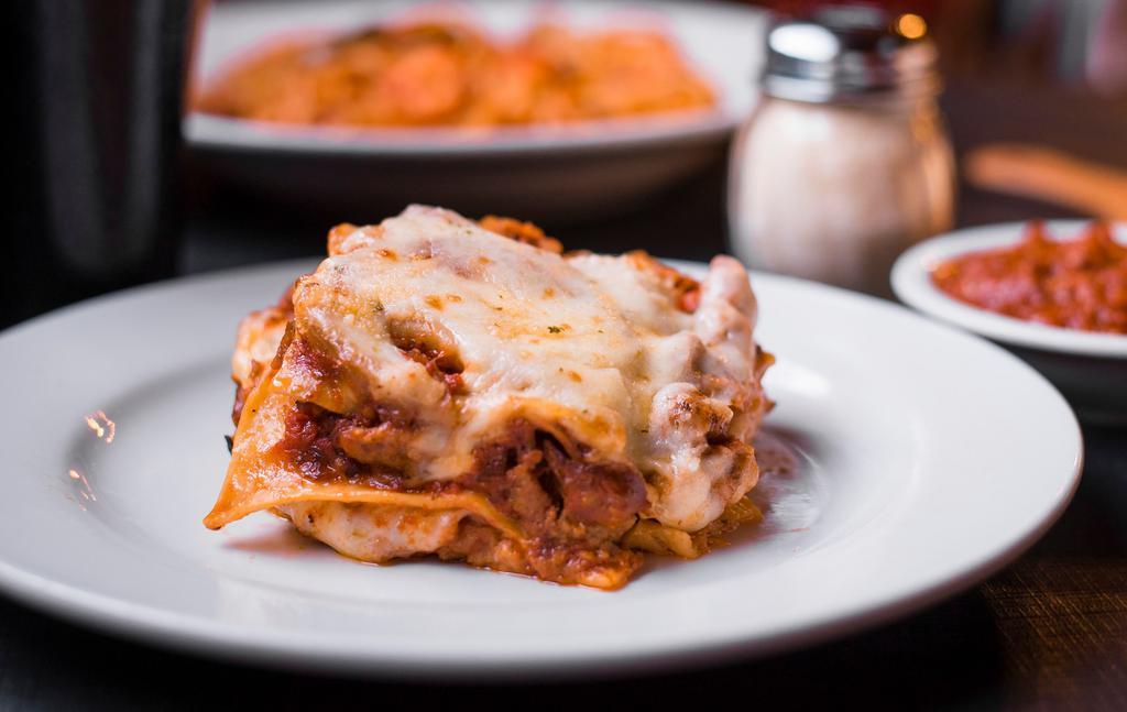 Warehouse Lasagna · Layers of lasagne noodles, our fresh-made meat sauce, Italian pork sausage, ground beef, Romano, ricotta and mozzarella, topped with more fresh-made meat sauce. Served with fresh bread and a choice of a soup or salad.