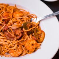 Shrimp Fra Diavlo · Jumbo shrimp in a SPICY tomato sauce made with hot cherry peppers over spaghetti.  Served wi...