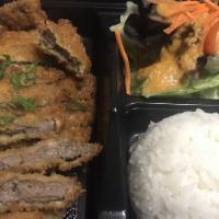 Pork Katsu · Japanese style deep-fried and breaded pork loin. Served with salad and white rice.