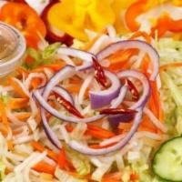 Kani Salad · Crab, cucumber, and tobiko on fried wonton skin.