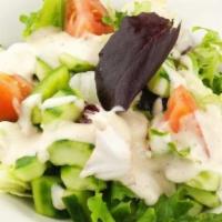 Exotic Green Salad · With healthy house ginger dressing.