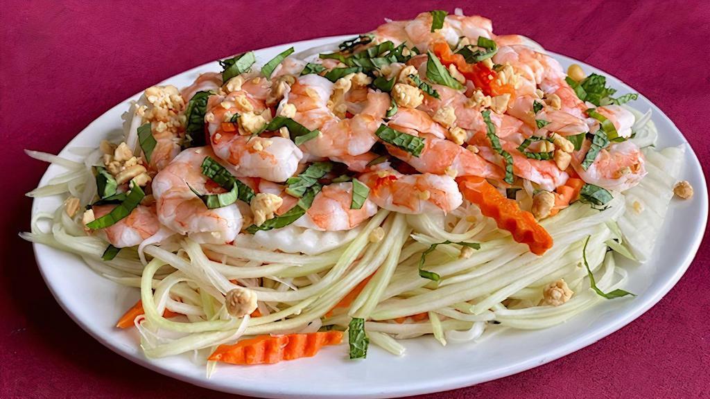 Shrimp With Green Papaya & Peanuts · Shrimp with shredded green papaya and pickled carrots in a zesty Vietnamese dressing. Topped with peanuts and fresh herbs.