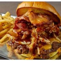 Jfk Burger · Sharp cheddar, applewood bacon, crispy onions, pickles, honey bbq.