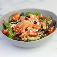 Smoked Salmon Salad · Toasted almonds, dried cranberries, grape tomatoes, and cucumbers with ginger dressing.