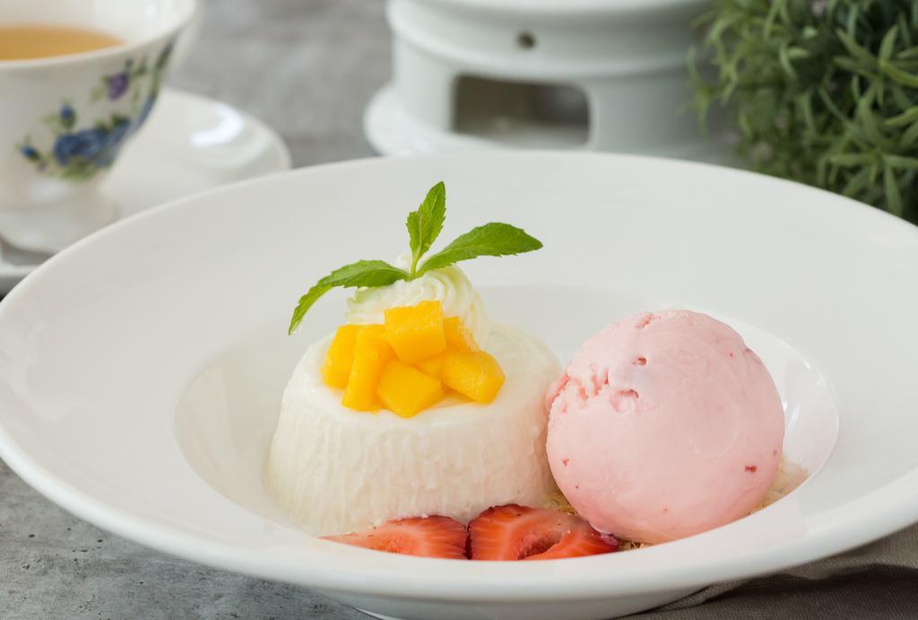 Coconut Panna Cotta · Serves with a scoop of Strawberry Ice Cream