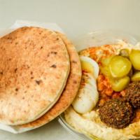 Hummus Bowl With Falafel · Chickpeas, paprika, and parsley with a drizzle of extra virgin olive oil. Served with two pi...