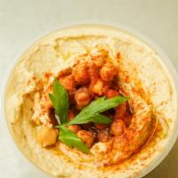 Hummus Side · Side of our creamy smooth home made topped with paprika, Evoo, and parsley.
