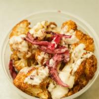 Fried Cauliflower · Topped with tahini and sumac onions.