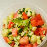 Chopped Israeli Salad · A mix of fresh cucumber, tomatoes, lemon juice, and extra virgin olive oil.