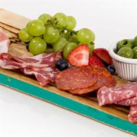 Cheese And Charcuterie Plate · Three meats, three cheeses, bread, crackers, fruit, olives.