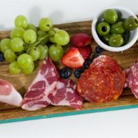 Charcuterie Plate · Three meats, bread, crackers, fruit, olives.