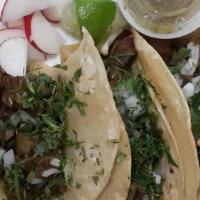 Tacos · Meat of choice, 3 soft shell tacos, cilantro, onion and salsa.
