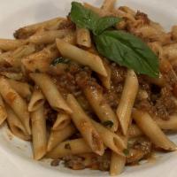 Penne Bolognese · Slow simmered ground beef sauce.