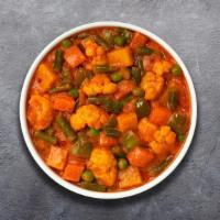 Navratan Korma  Neverland · Mixed vegetables cooked in delicate fresh spices, tomatoes and onions