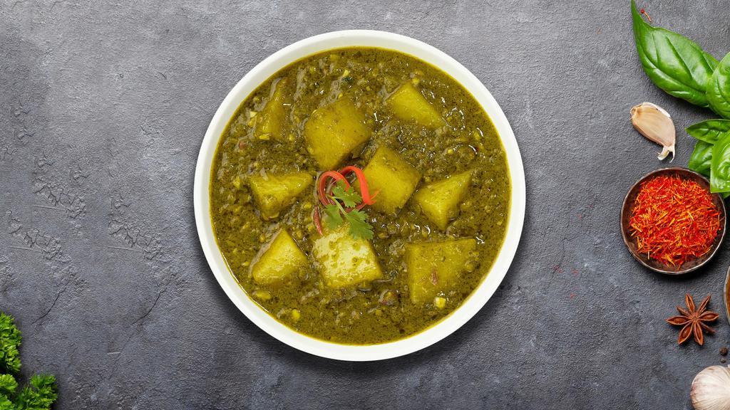 Saag Survival Aloo · Idaho potato cubes cooked in a spinach gravy infused with garlic, ginger & fresh spices.