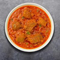 Lost In Lamb Bhuna · Lamb cooked in hot spicy curry infused with onions and tomatoes.