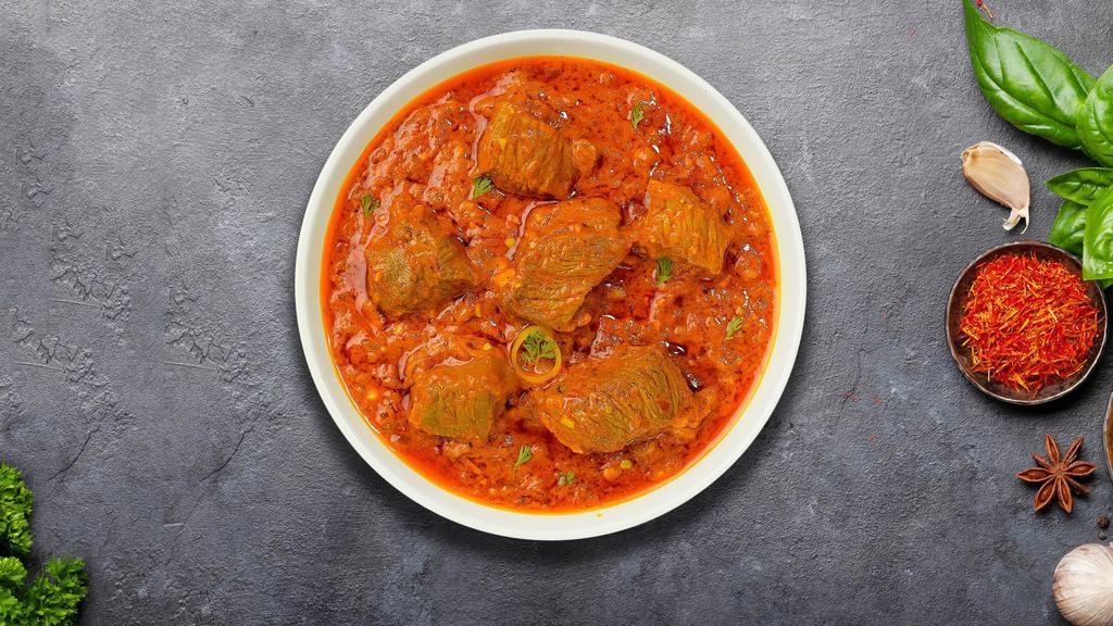 Lost In Lamb Bhuna · Lamb cooked in hot spicy curry infused with onions and tomatoes.